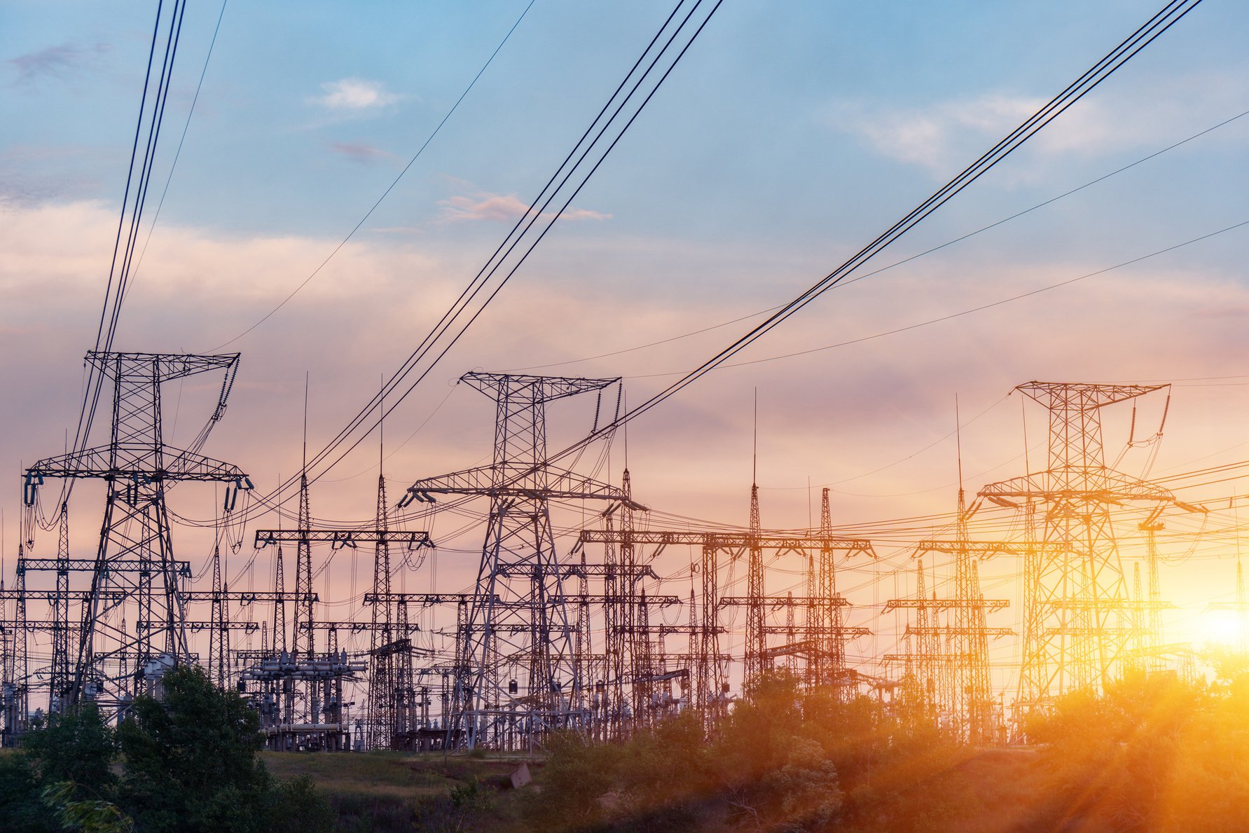 High-voltage power lines. Electricity distribution station. high voltage electric transmission tower. Distribution electric substation with power lines and transformers